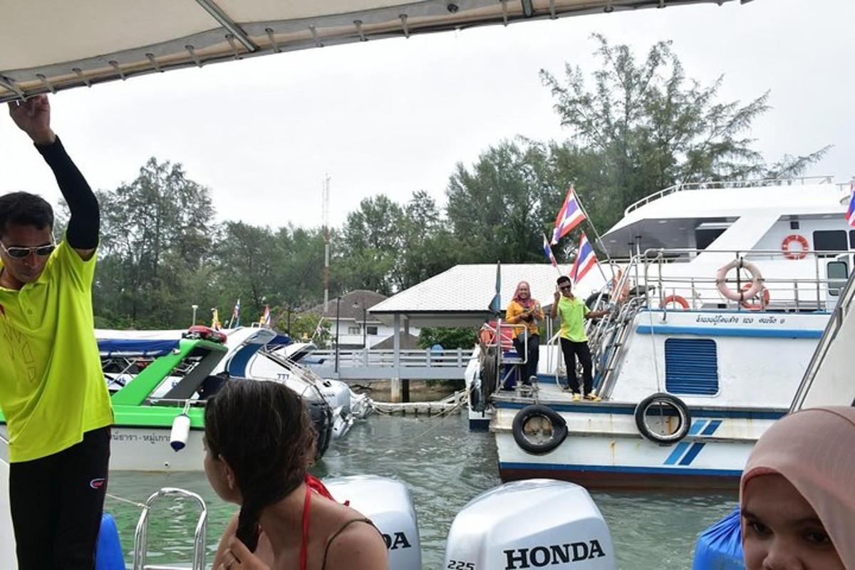a group of people on a boat in the water