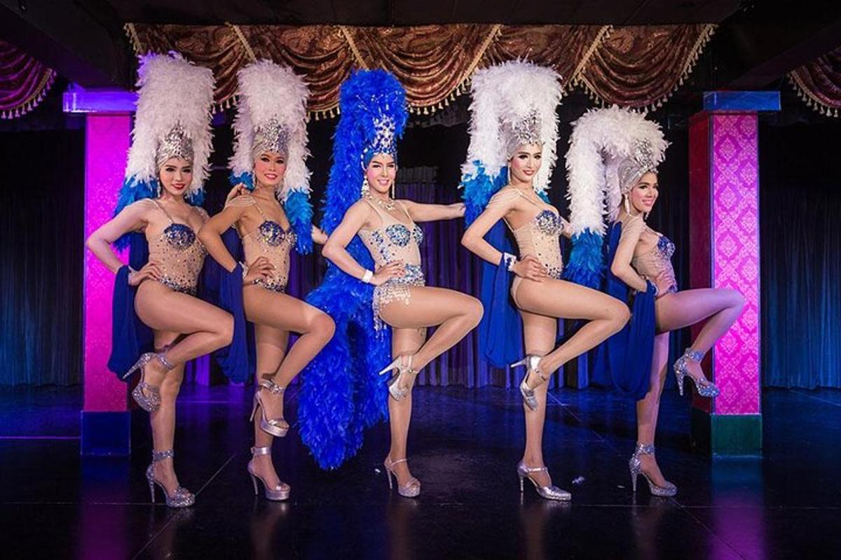 a group of women in costumes on a stage