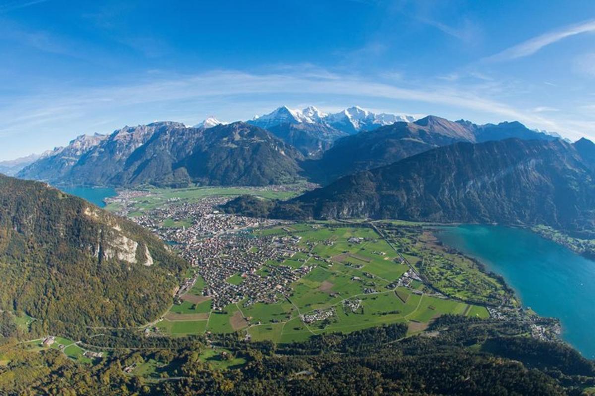 an aerial view of a town in the mountains