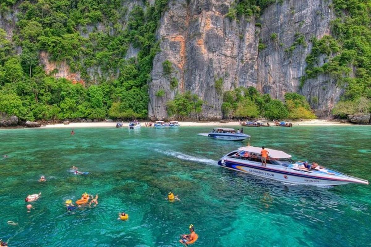 a group of people in the water near a boat