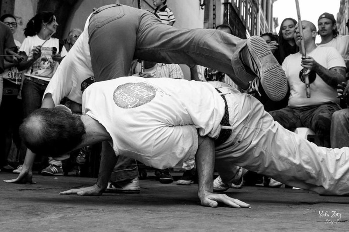 a man is on the ground in front of a crowd