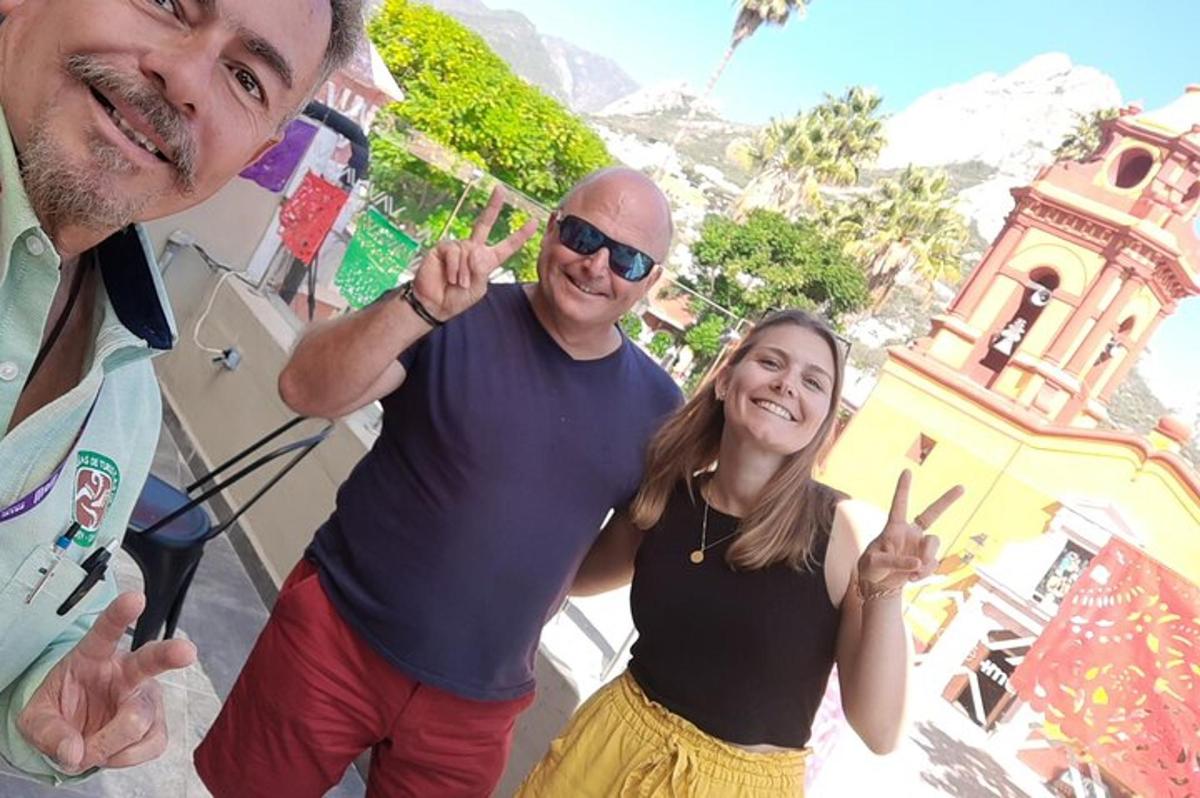 a man and a woman making the peace sign with their hands