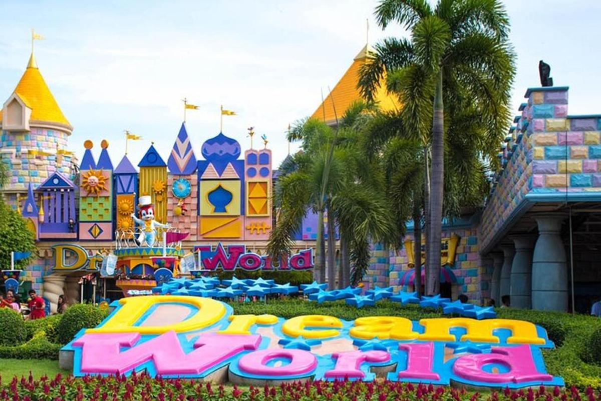 a sign in front of a disney park