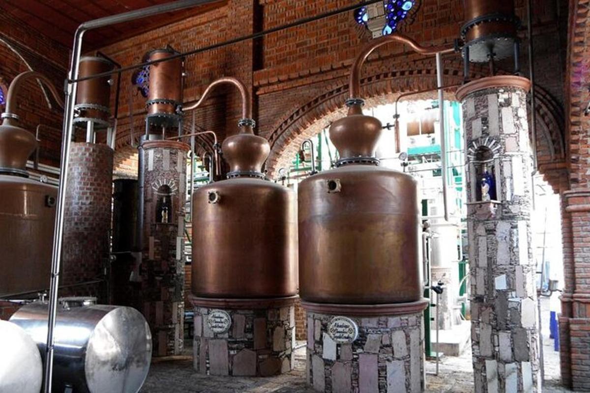 a row of copper vases in a building