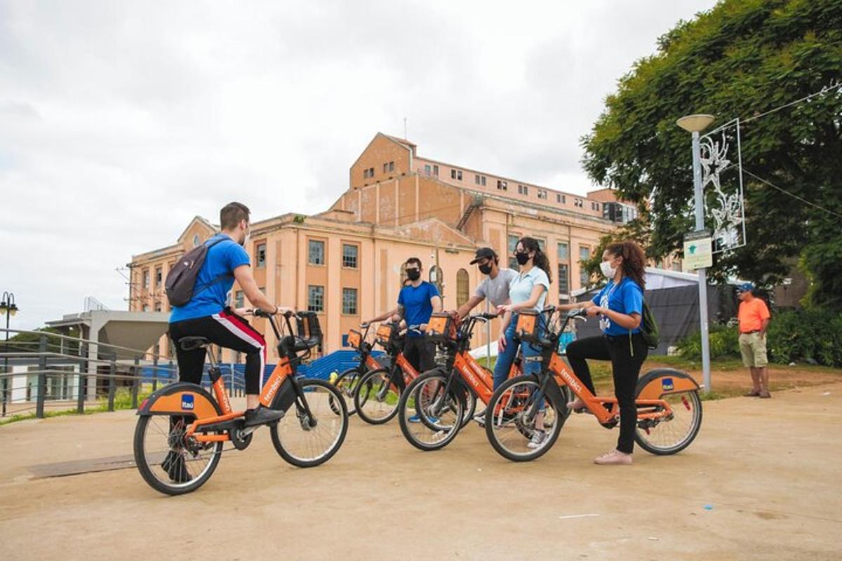 a group of people riding bikes in front of a building