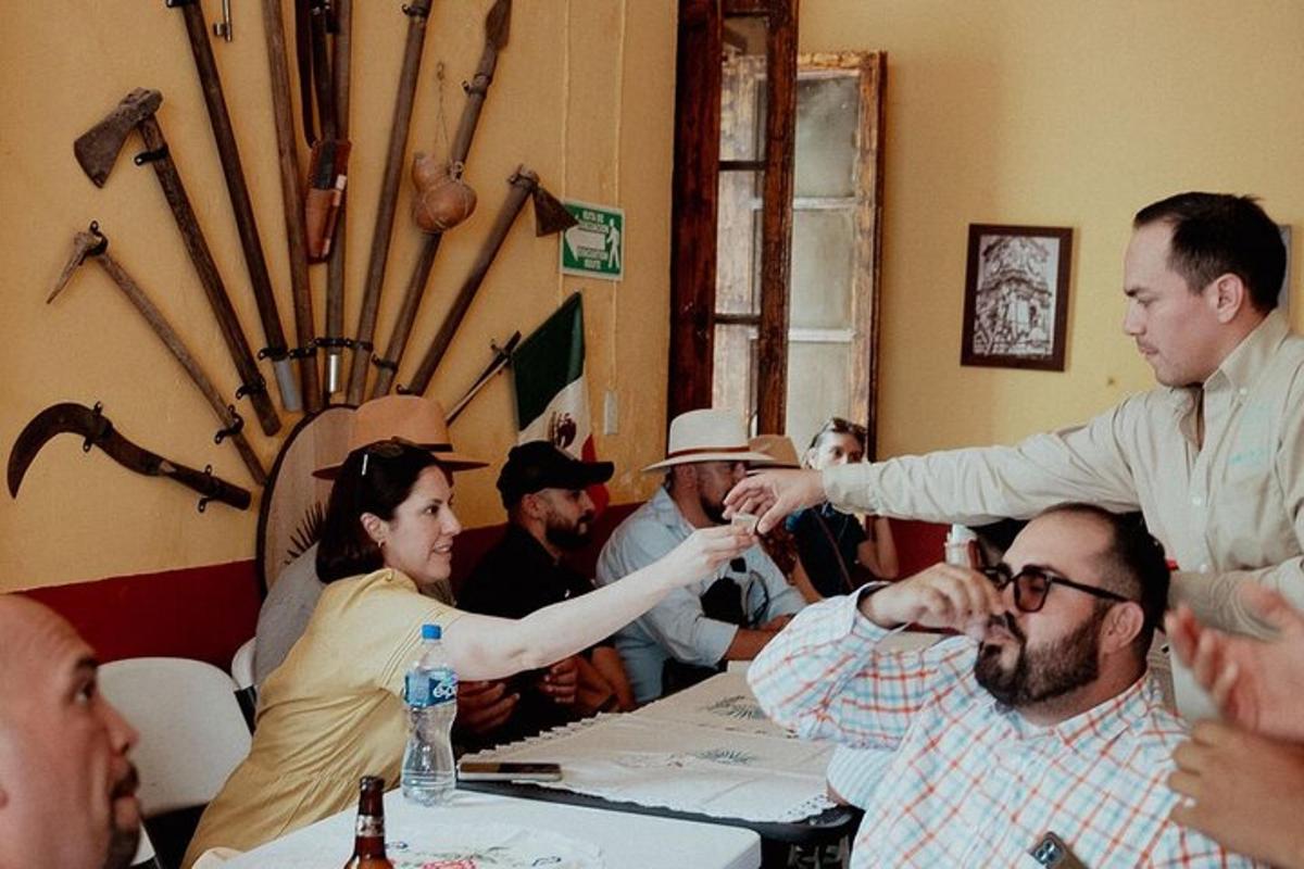 a group of people sitting around a table in a room