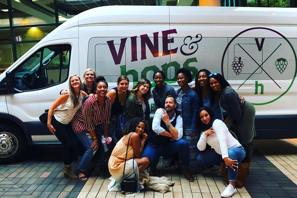 a group of people standing in front of a van