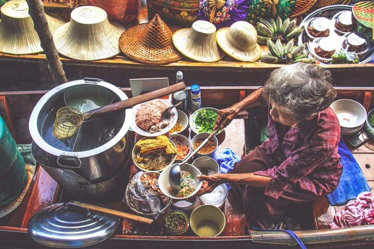 a woman preparing food on a table with bowls of food