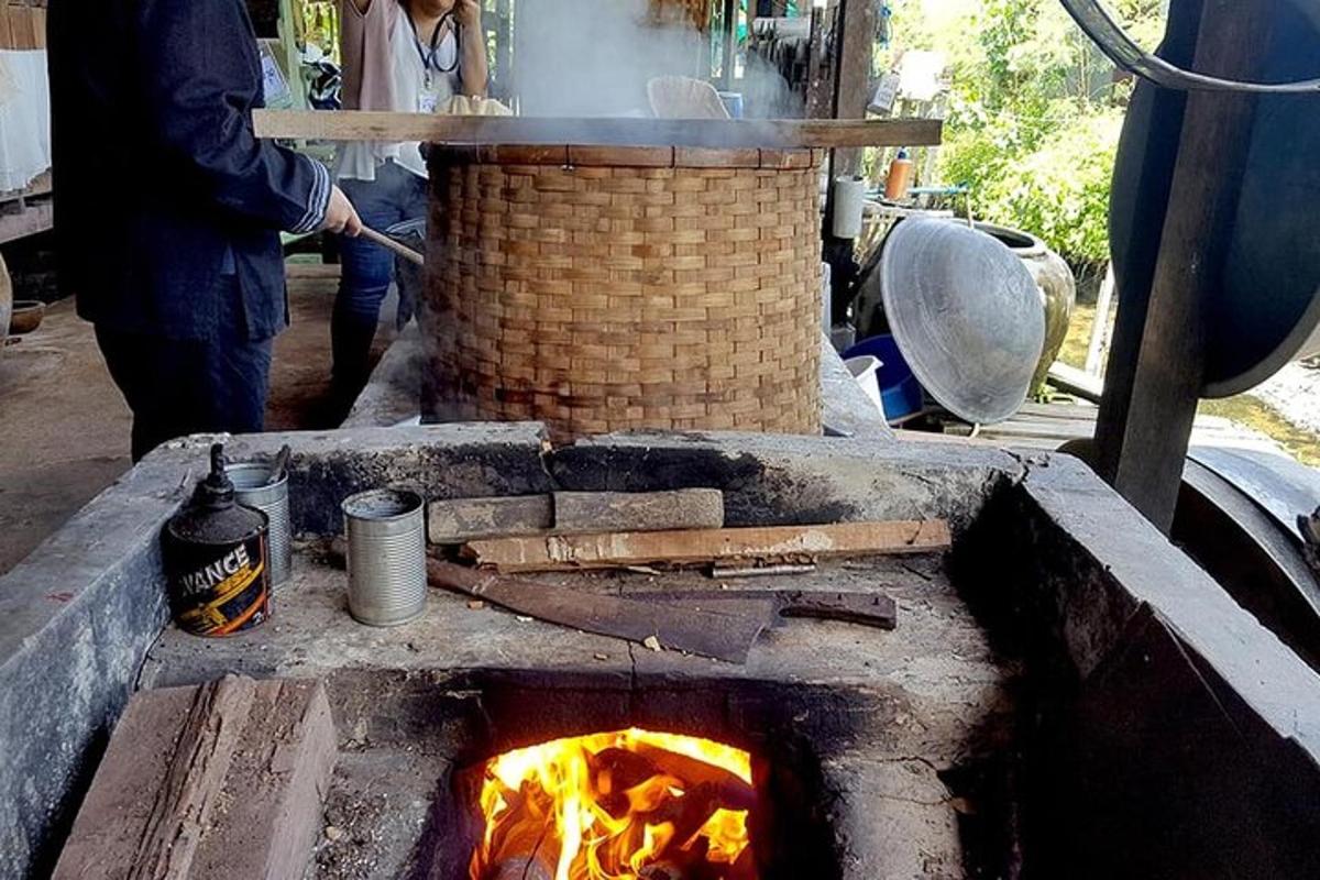 a man is cooking food in a stone oven