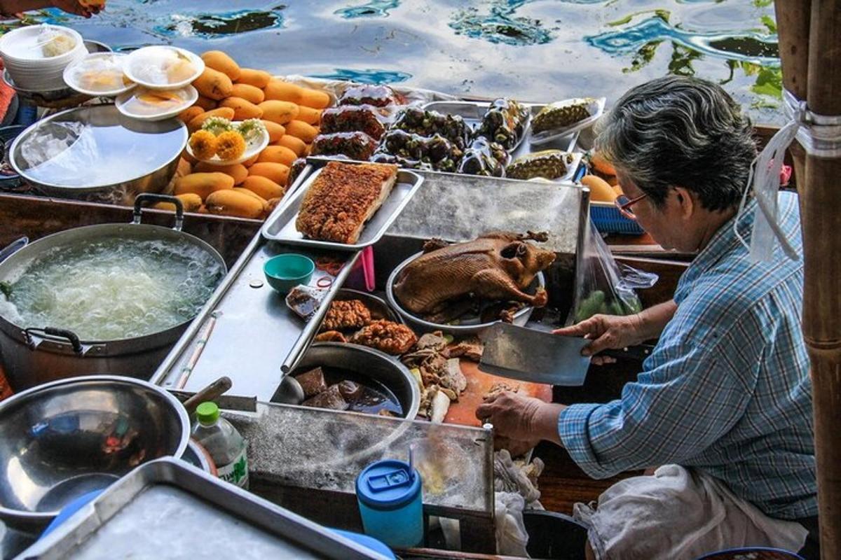 a man preparing food on a table with food