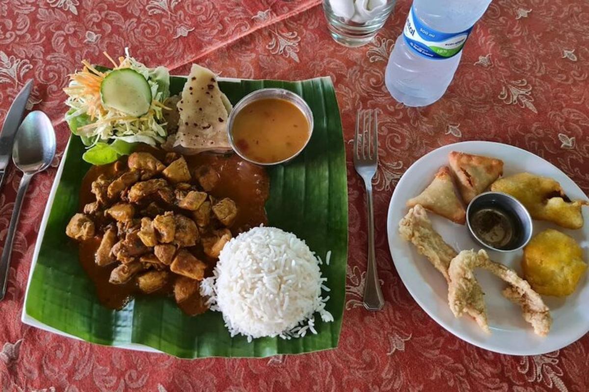 a plate of food with rice and other foods on a table