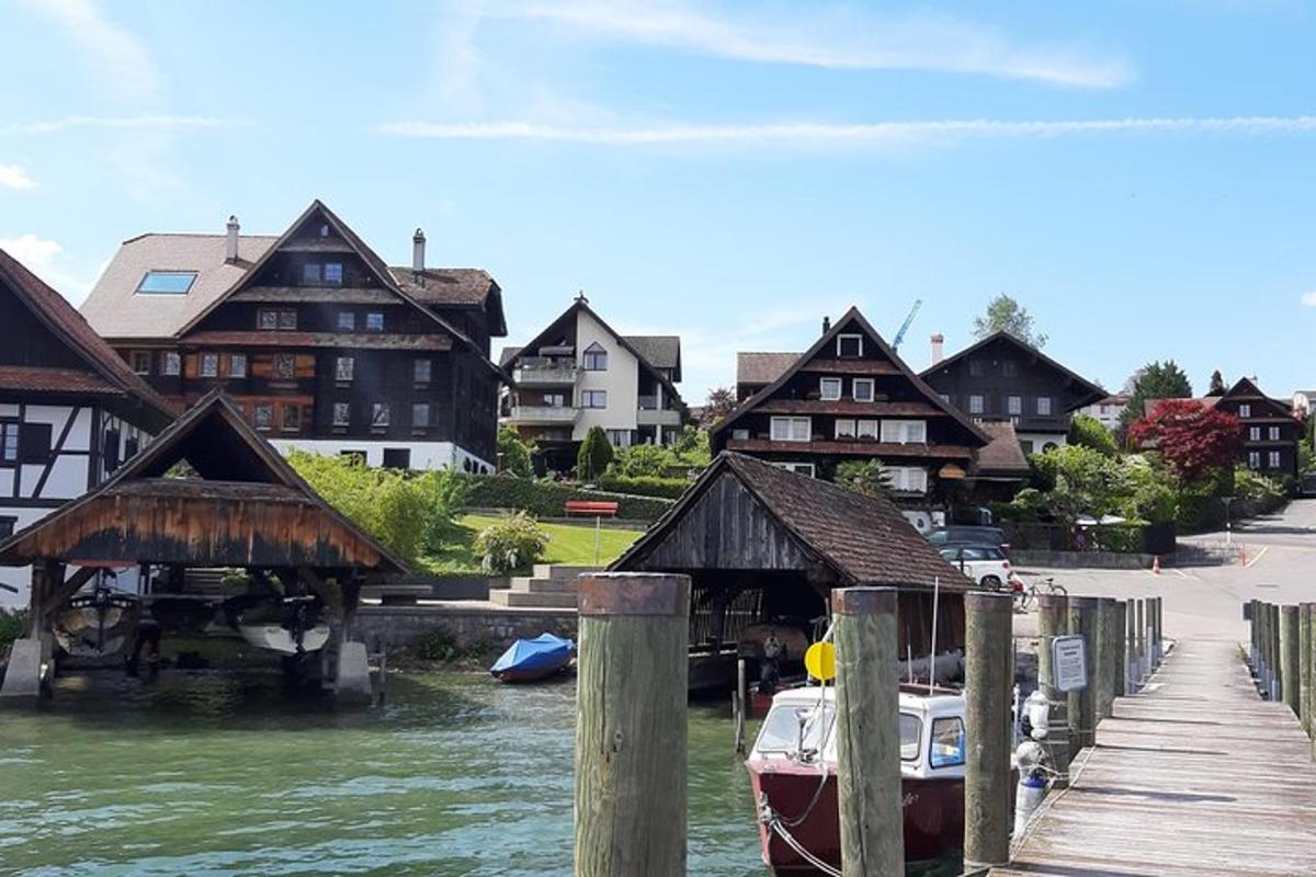 a boat is docked next to a dock with houses