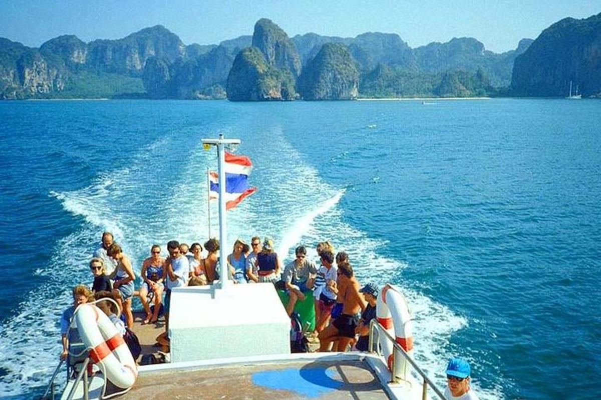 a group of people on a boat in the water