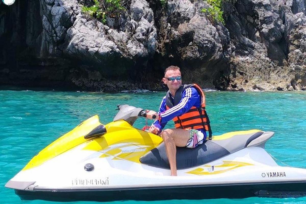 a man sitting on a jet ski in the water