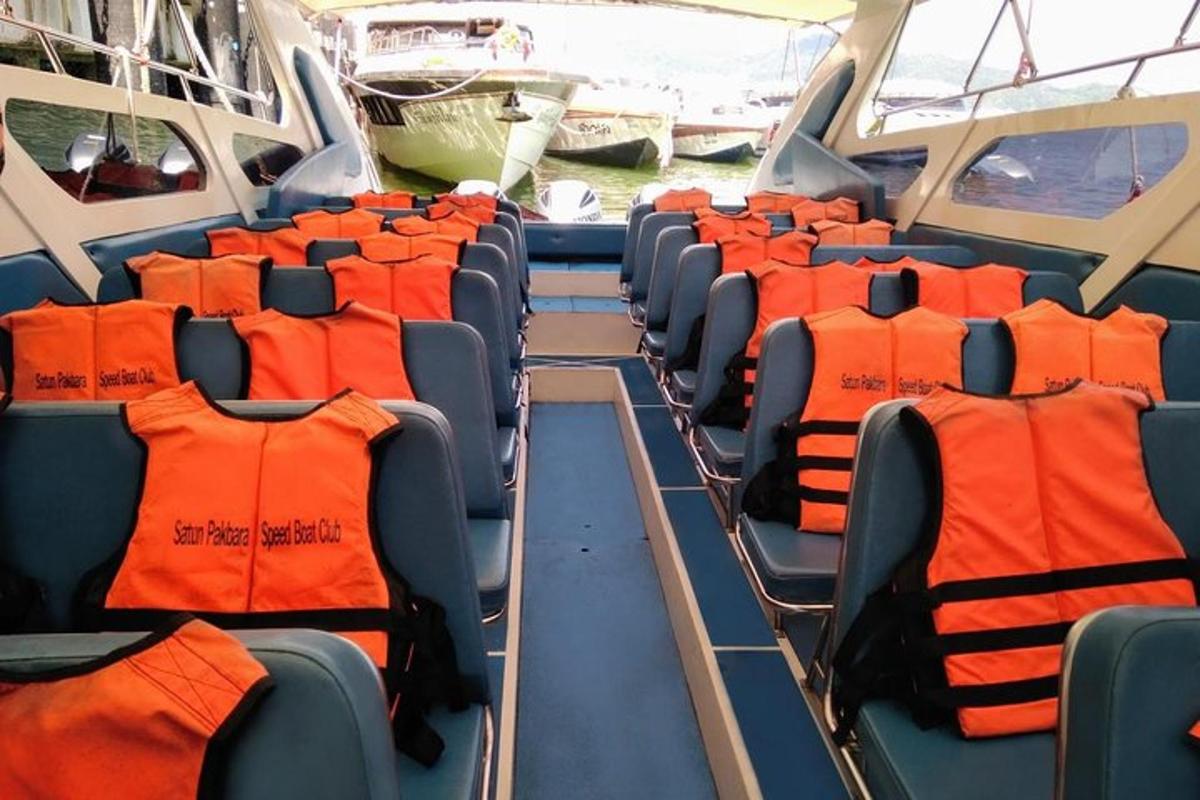 a group of seats in a bus with orange seats