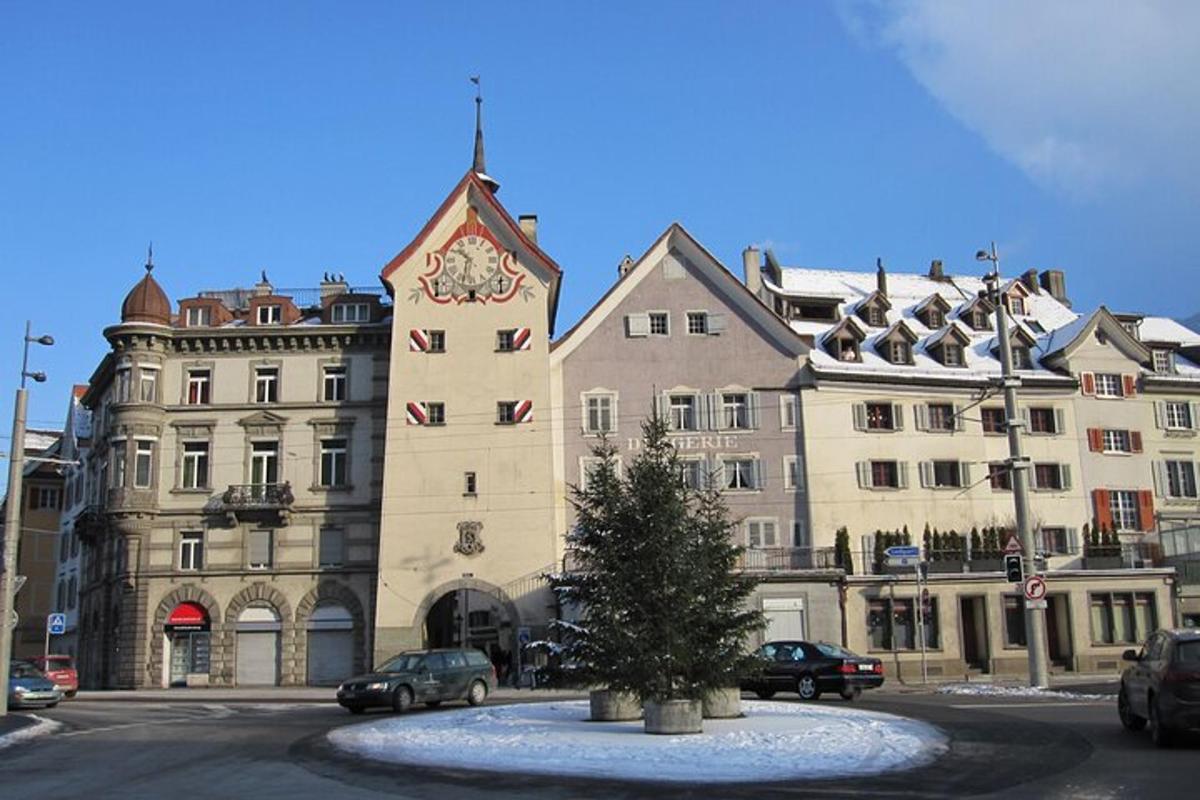 a building with a clock tower in front of it