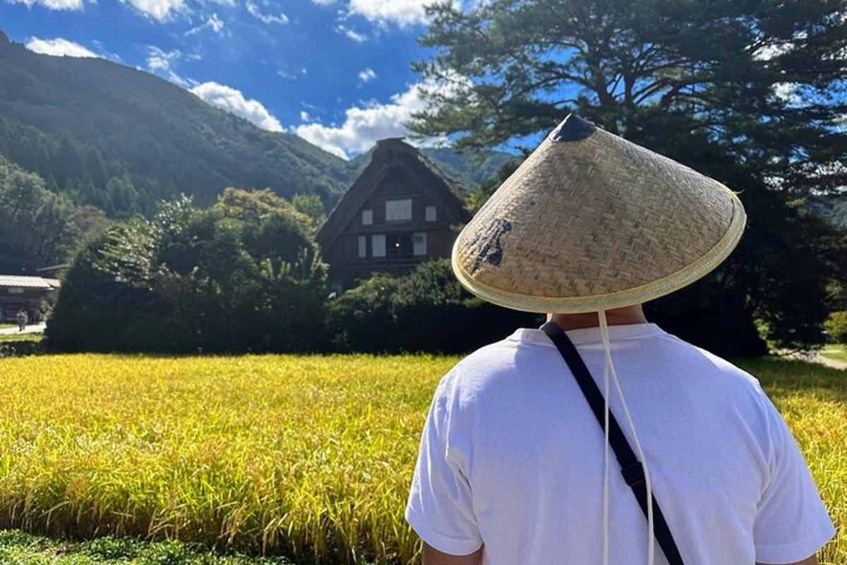 a person wearing a hat standing in a field