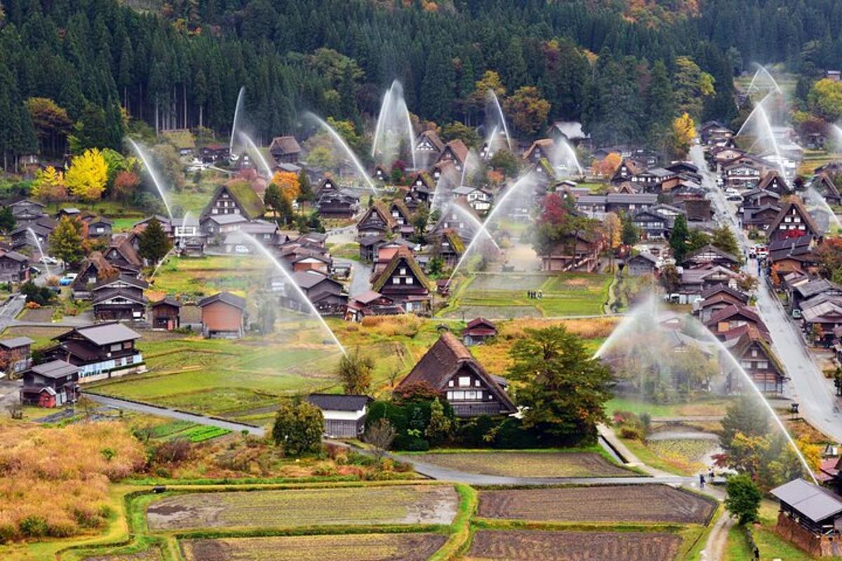 a small village with water spraying in the air