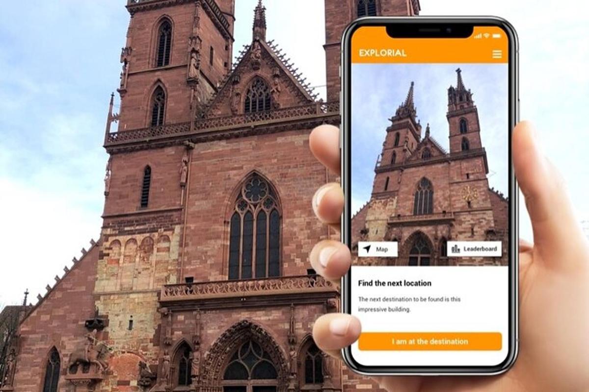 a person holding a cell phone in front of a church