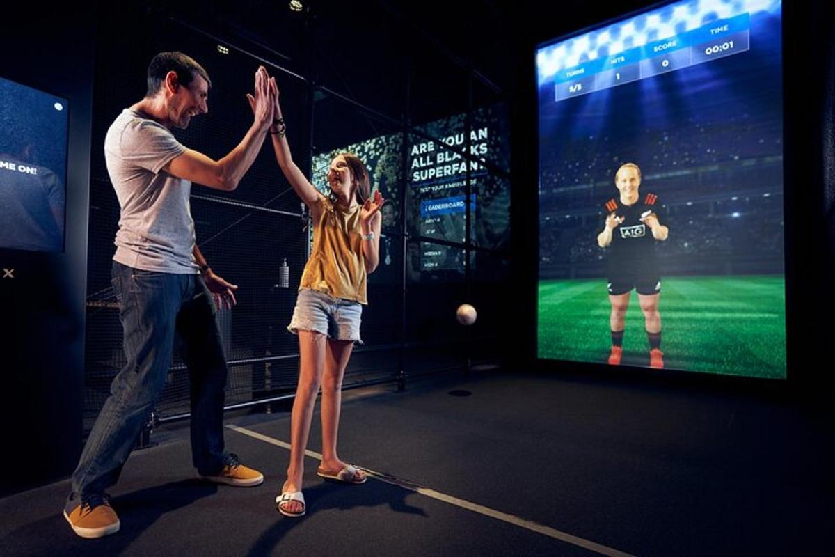 two people giving each other a high five in front of a video game