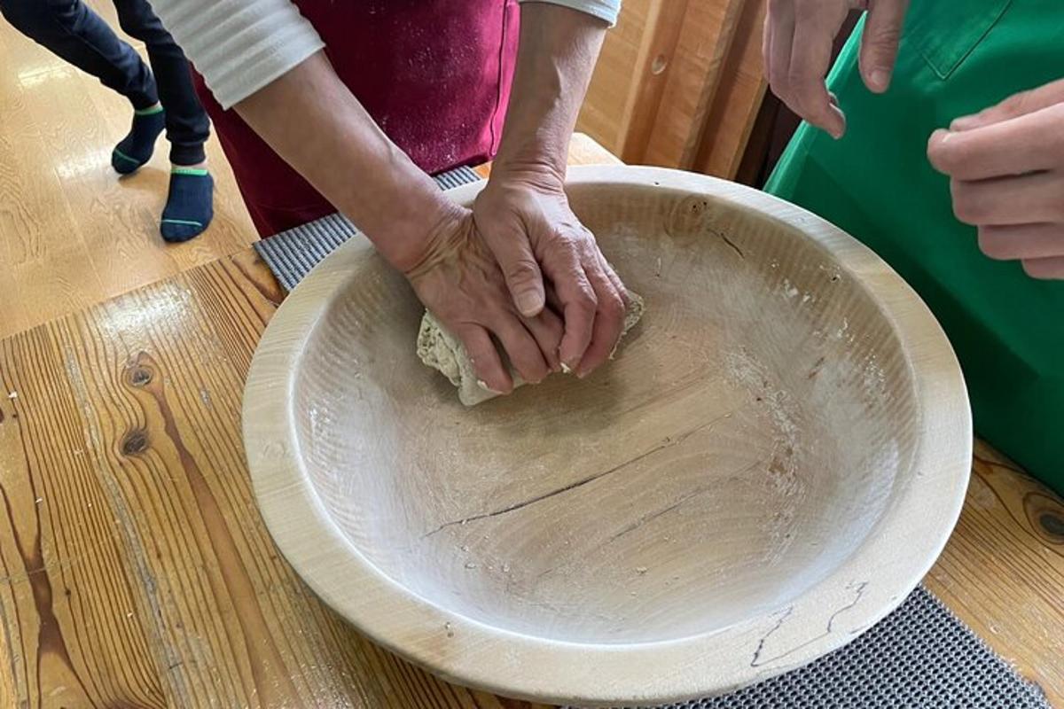 a person with their hands on top of a bowl