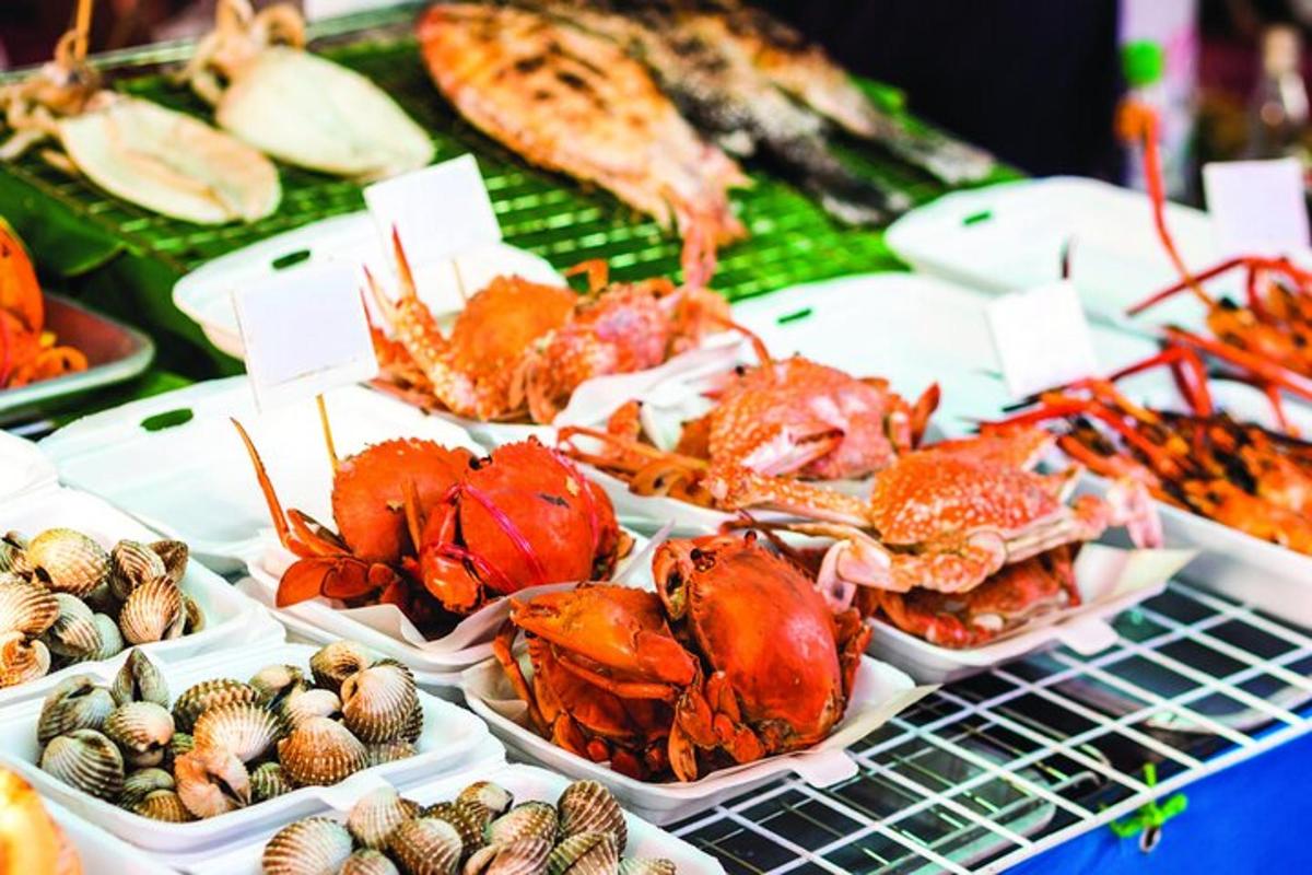 a buffet of lobsters and other seafood on a table