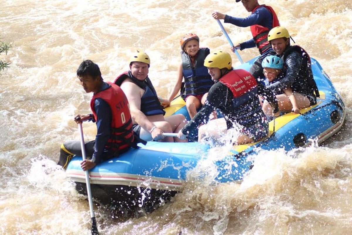 a group of people on a raft in the water