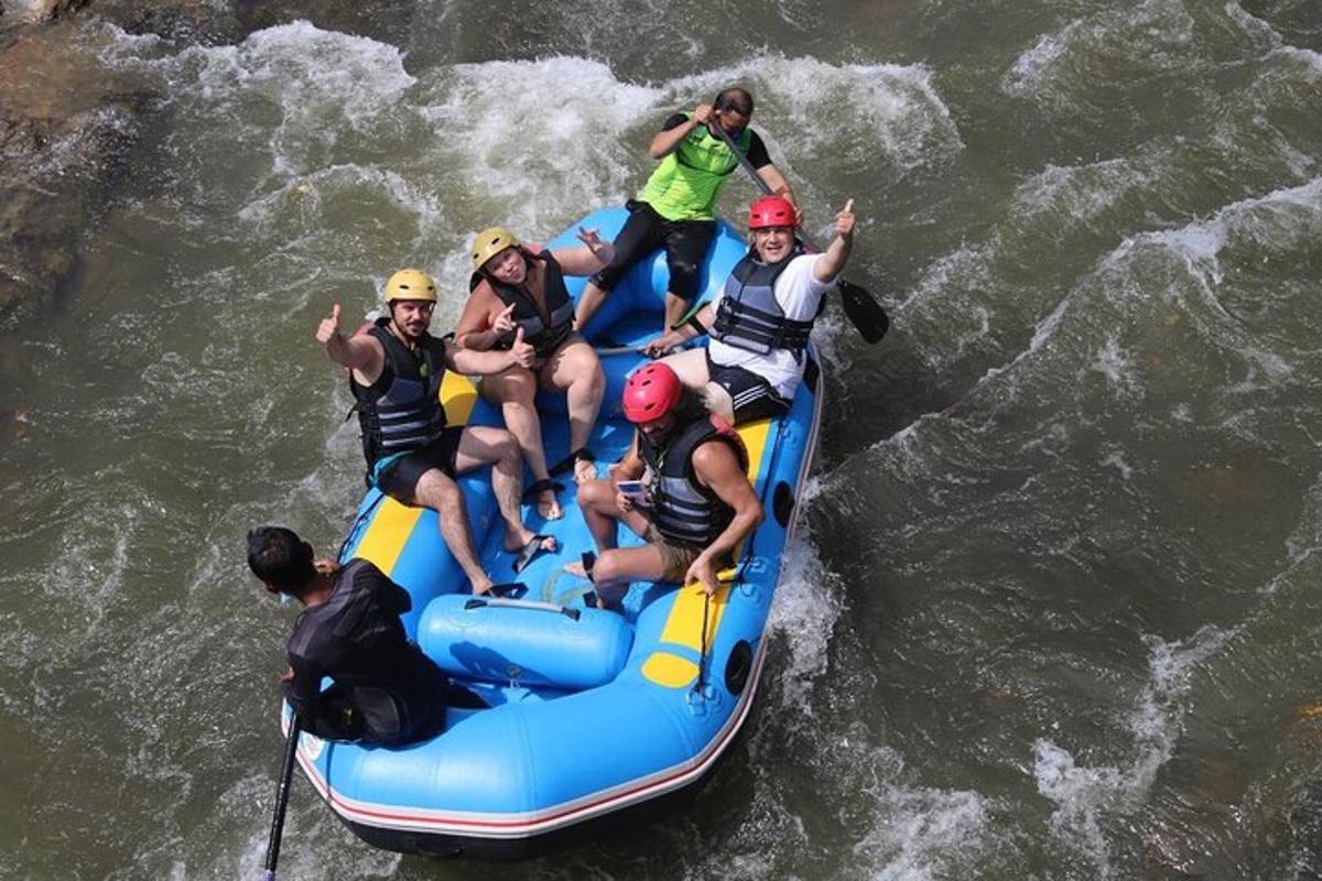 a group of people on a raft in the water