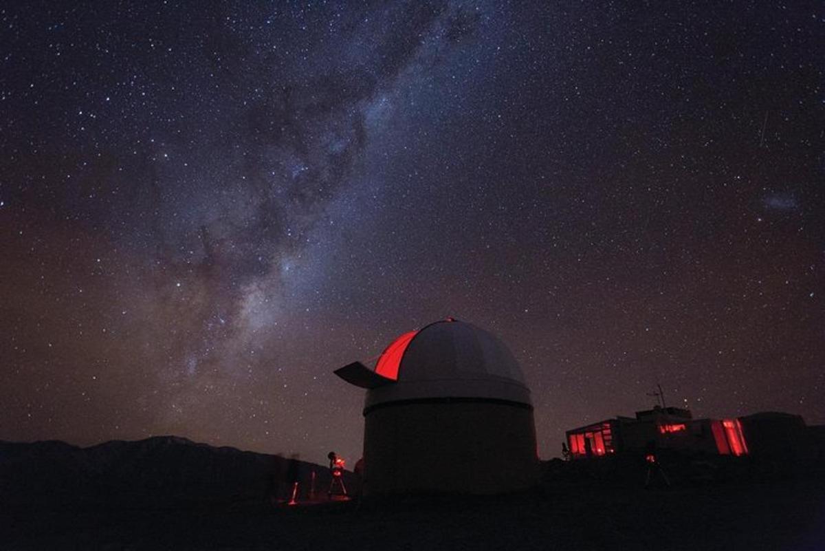 a observatory at night with the milky way