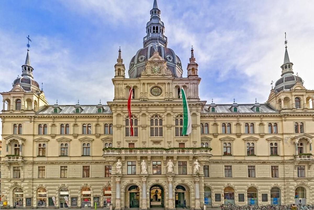 a large building with two flags in front of it