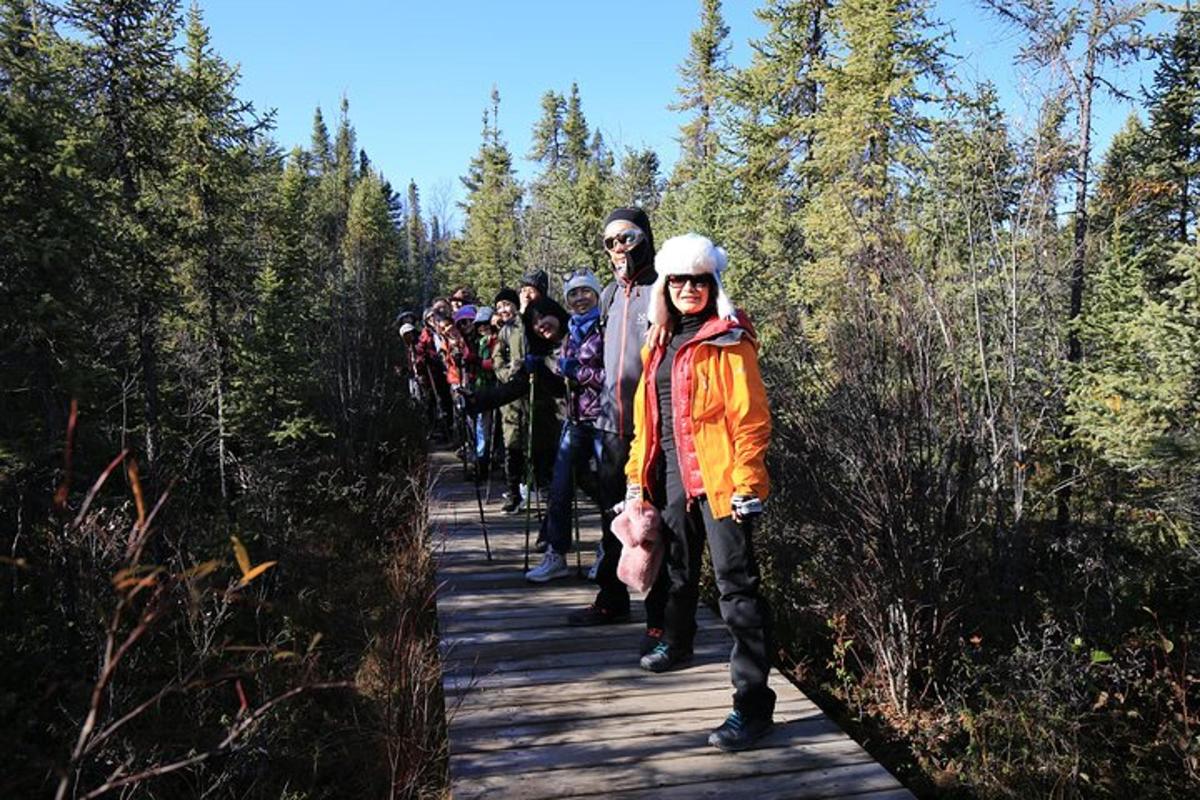 a group of people walking on a trail