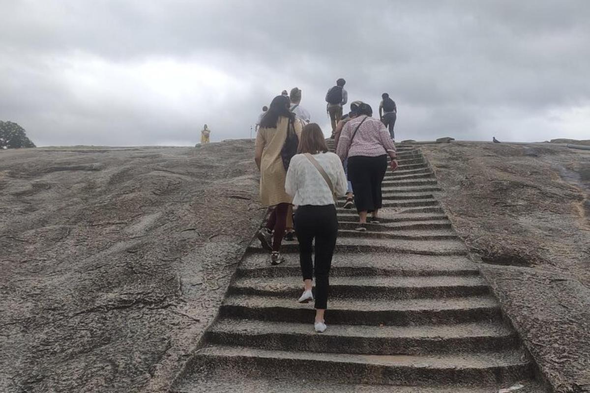 a group of people walking up a set of stairs