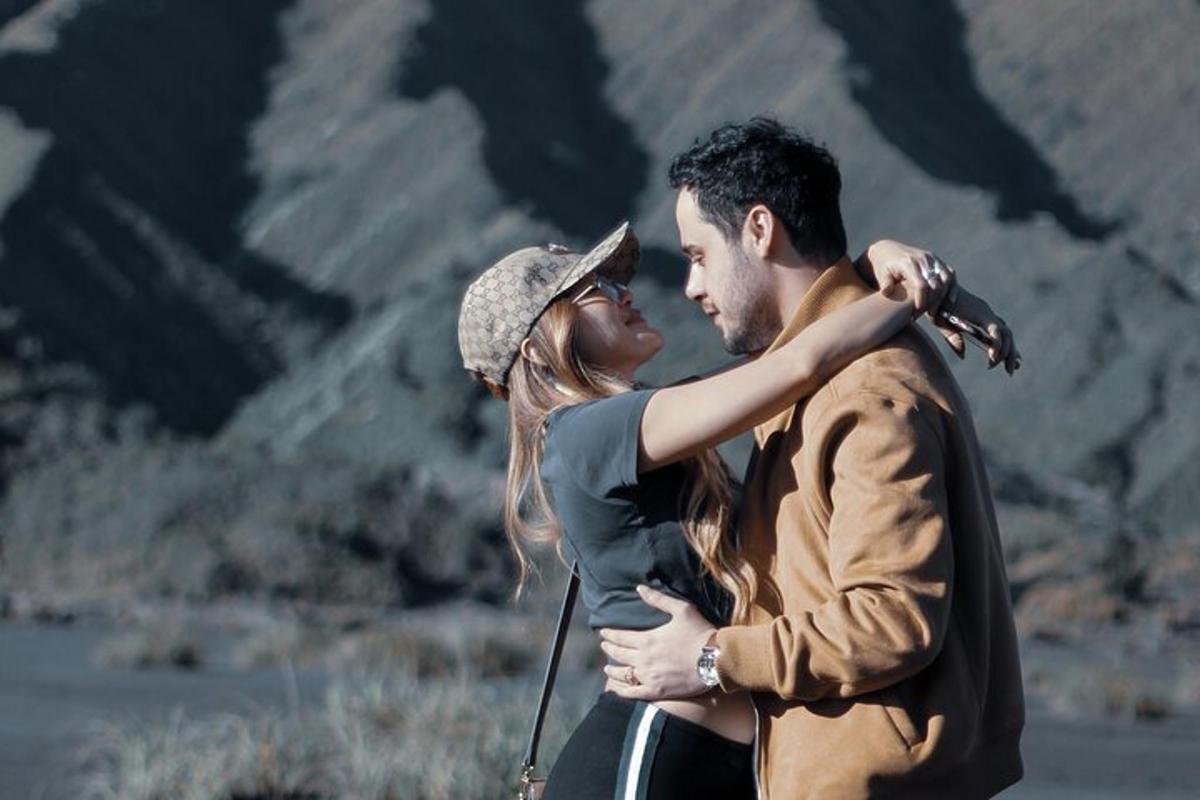 a man and a woman standing next to each other