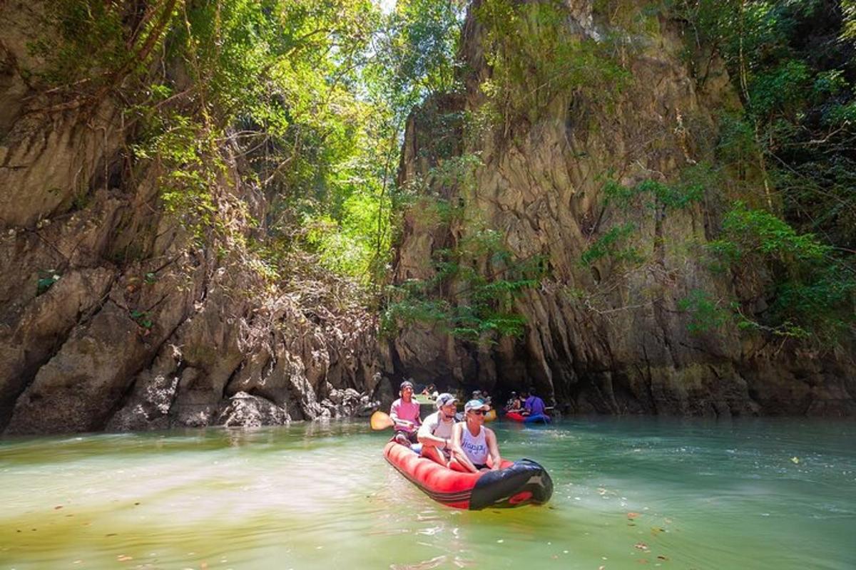 a group of people riding on a raft in the water