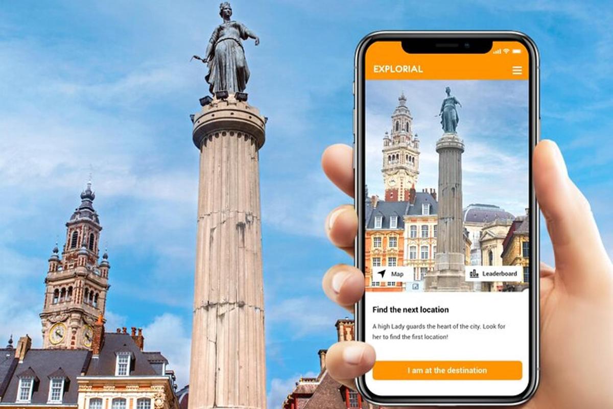 a person holding up a cell phone in front of a statue
