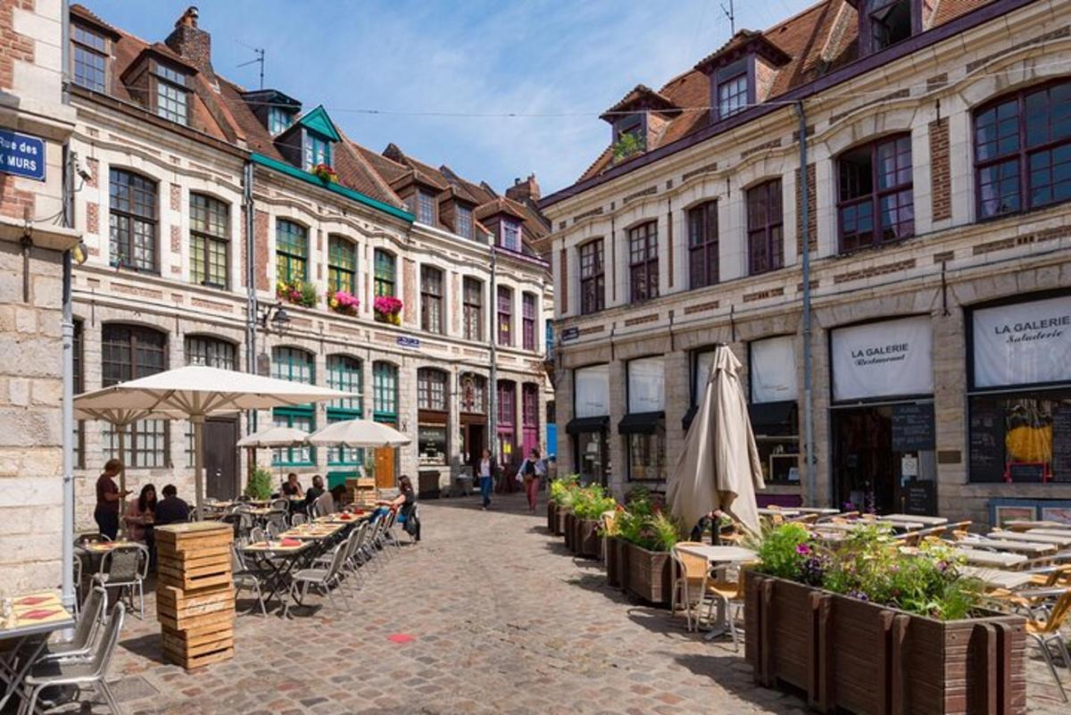 a city street with tables and chairs and buildings
