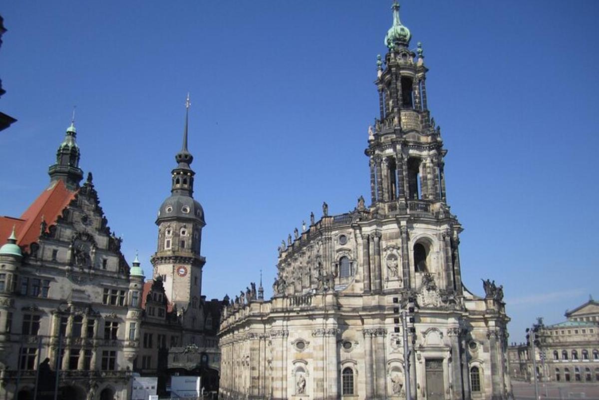 an old building with two towers and a clock tower