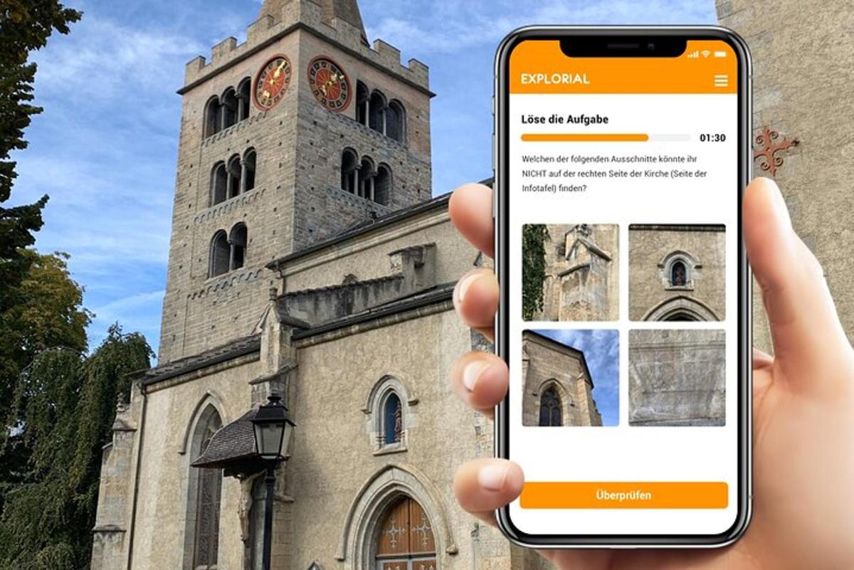 a person holding a cell phone in front of a church