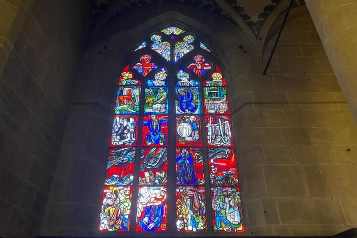 a large stained glass window in a church