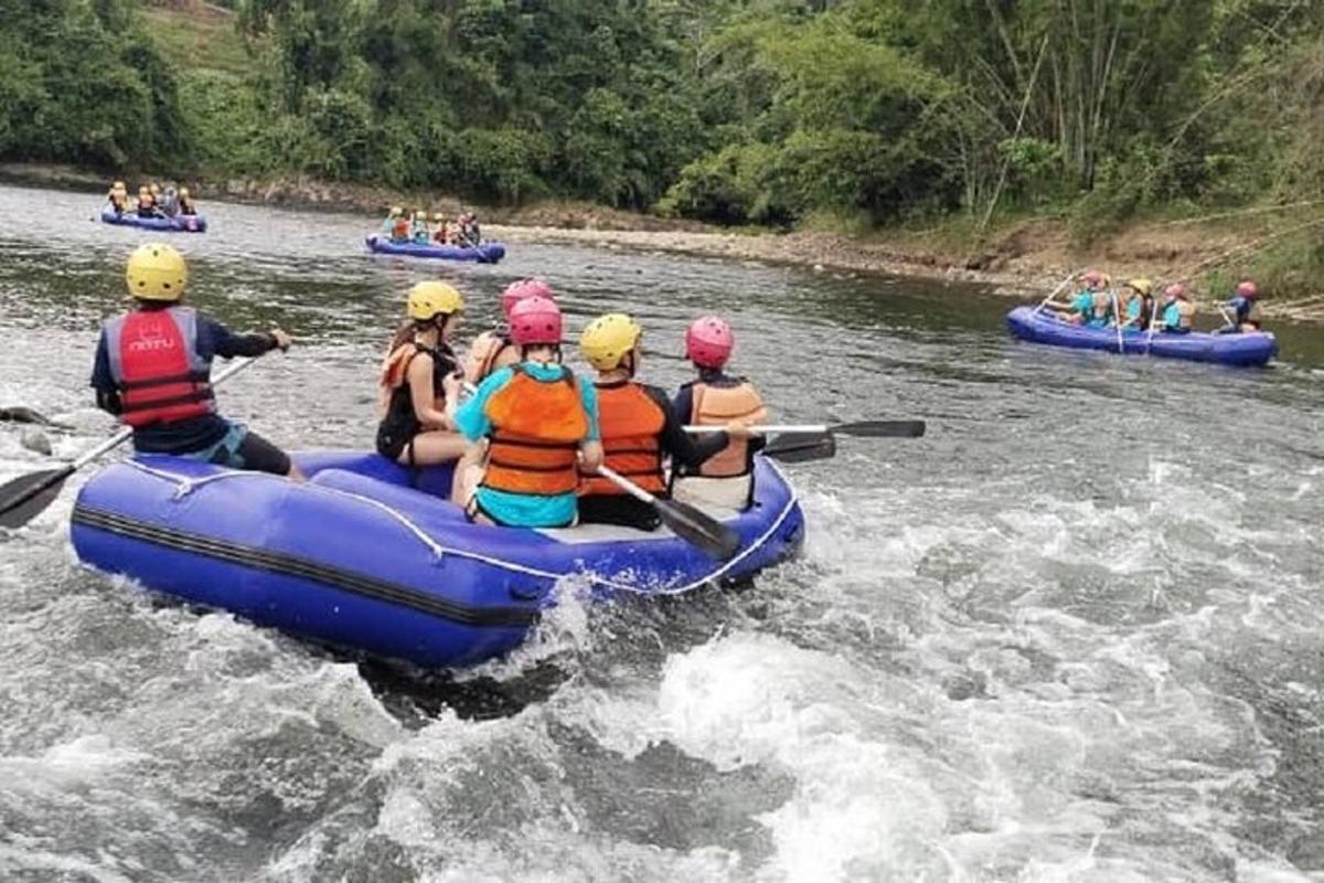 a group of people in a raft on a river