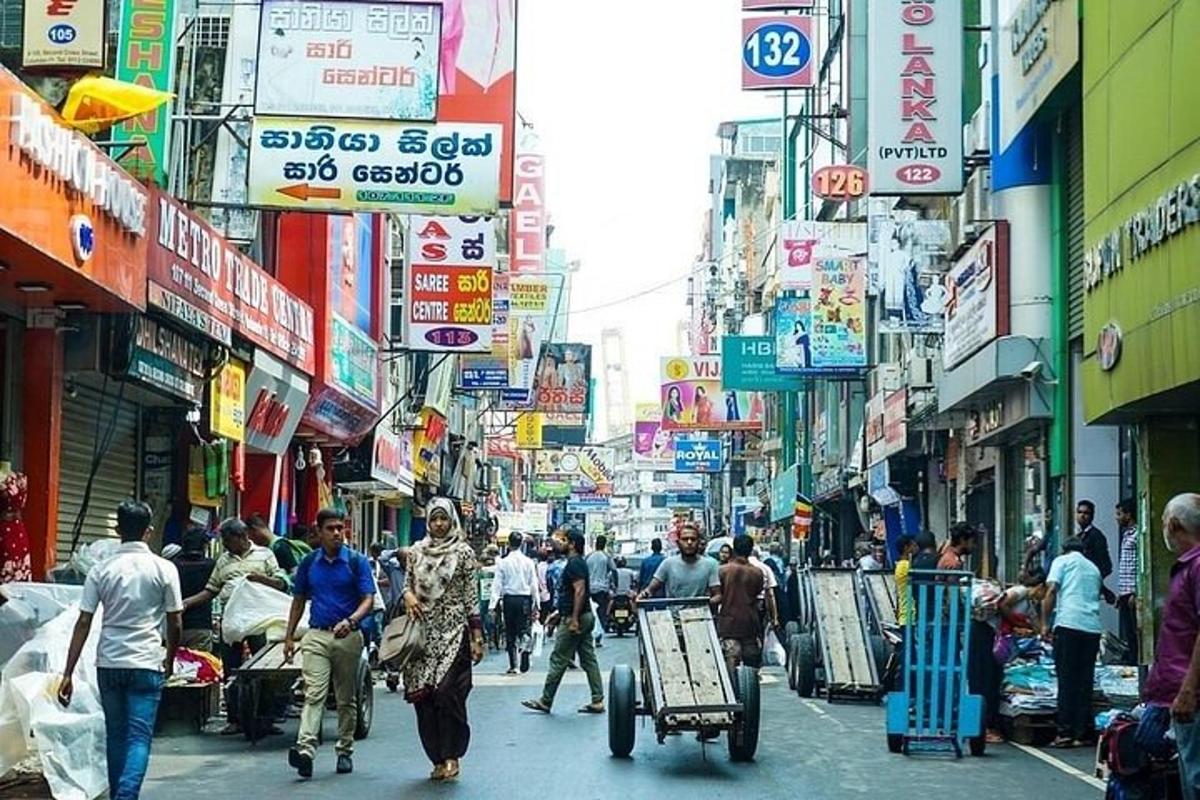 a group of people walking down a busy city street
