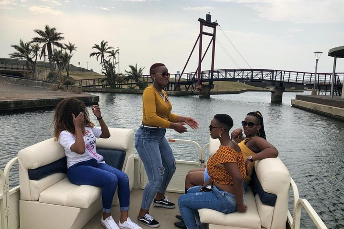 a group of people sitting on a boat in the water