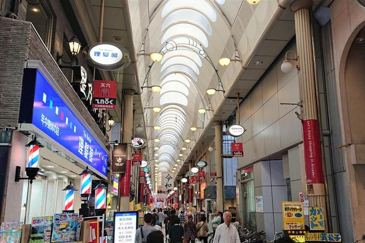 a shopping mall with domed ceilings and people walking in it