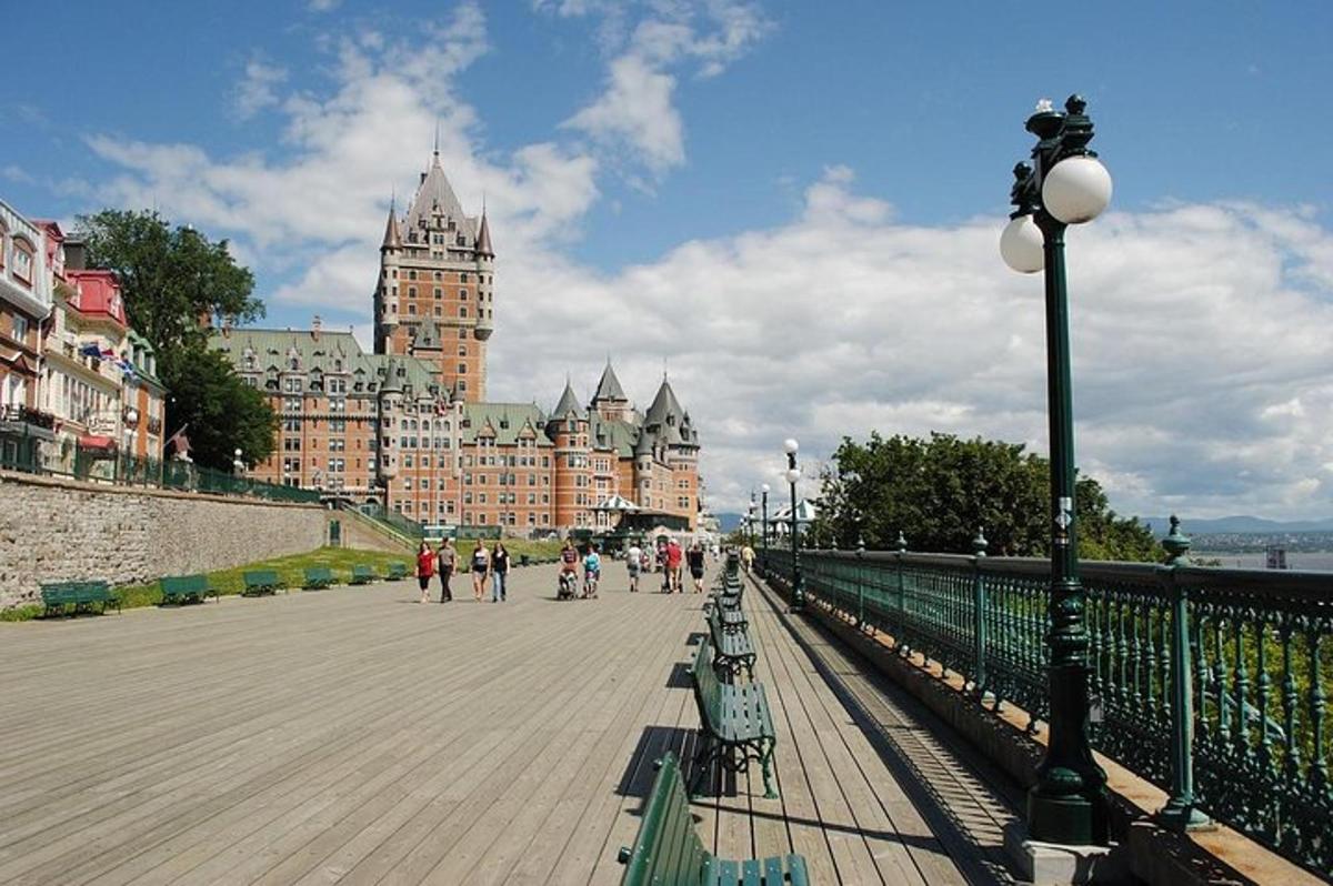 a bridge over a river with a large building
