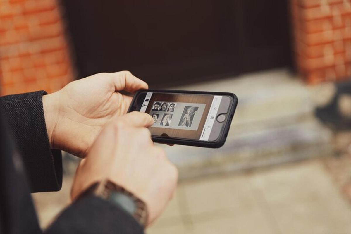 a person taking a picture with a cell phone