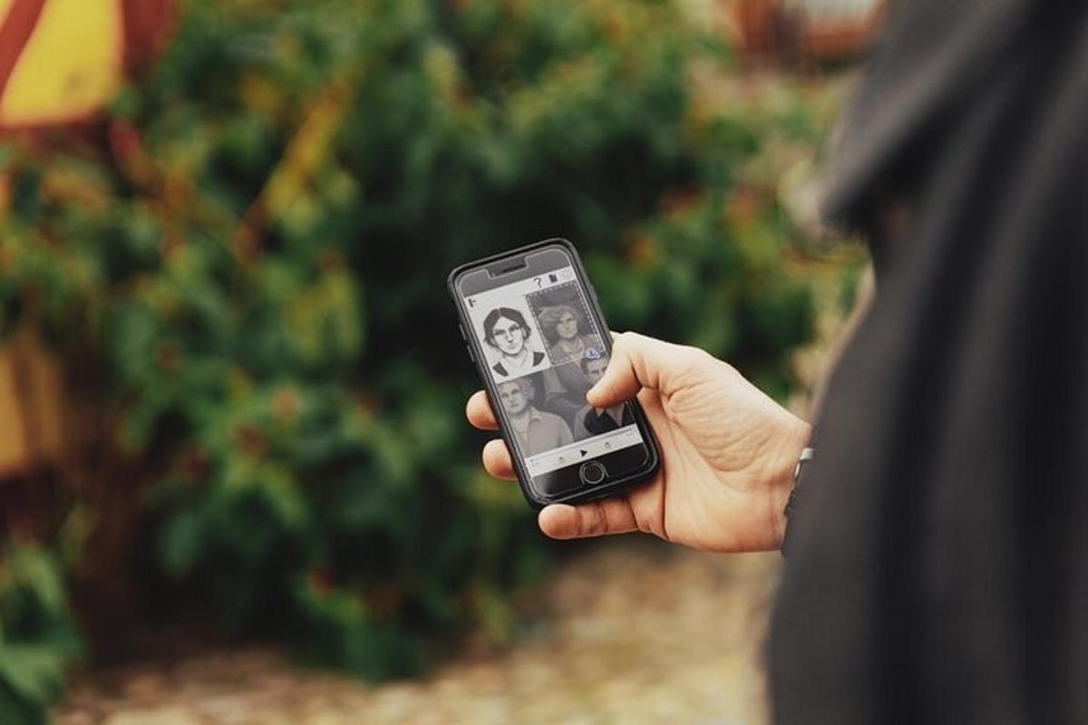 a person holding a cell phone in their hand