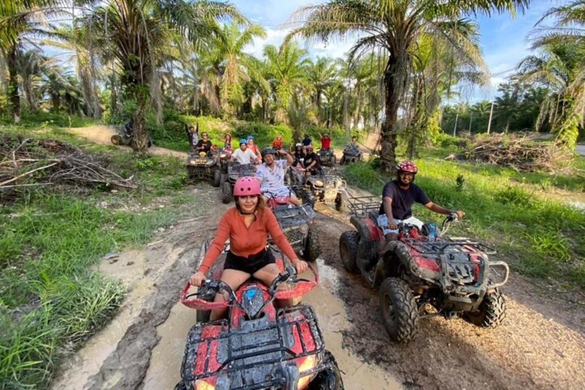 a group of people riding atvs on a dirt road