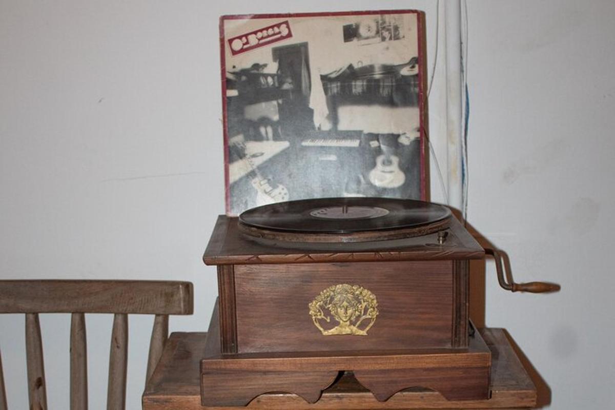 an old clock sitting on top of a wooden box