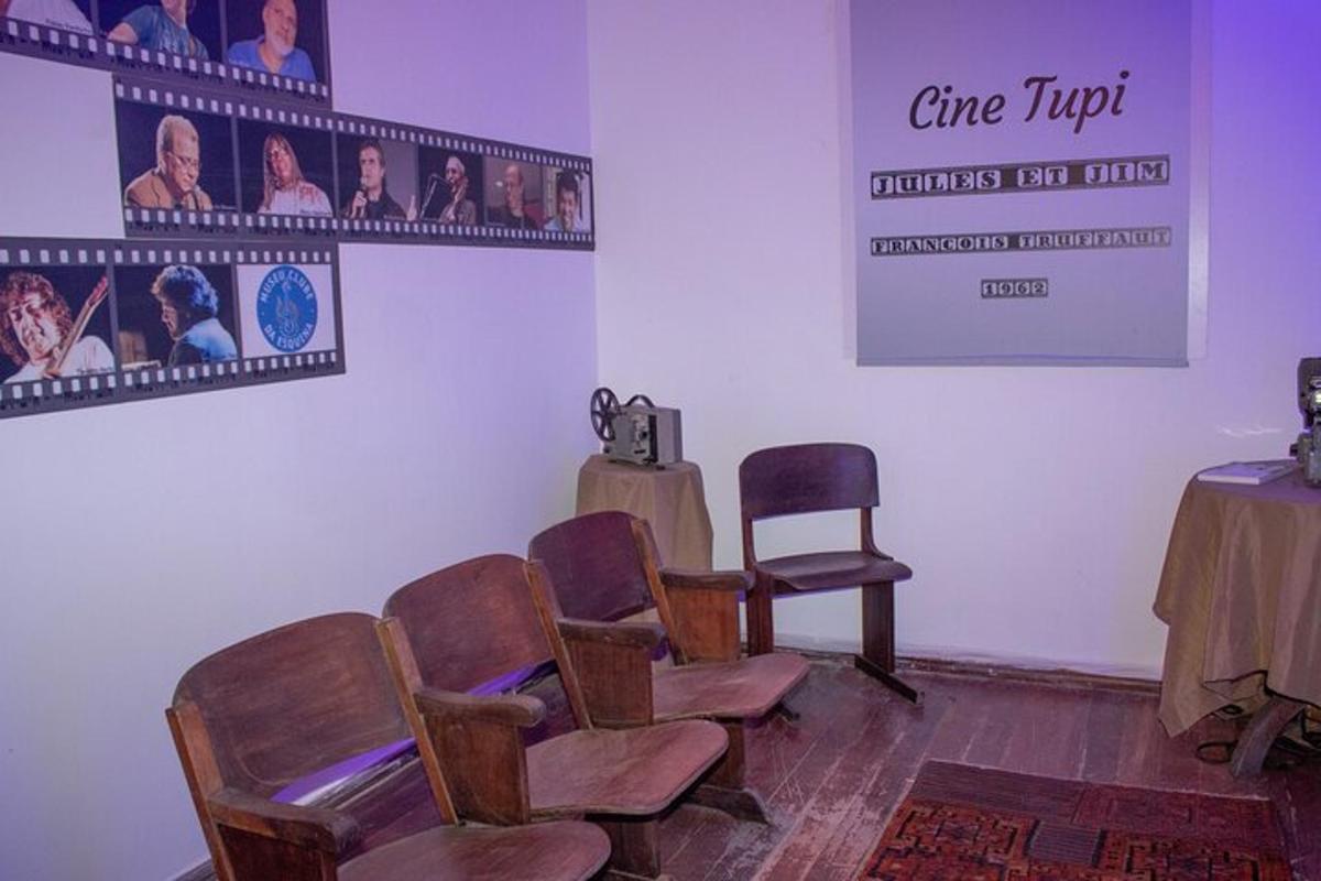 a waiting room with chairs and a table and a sign