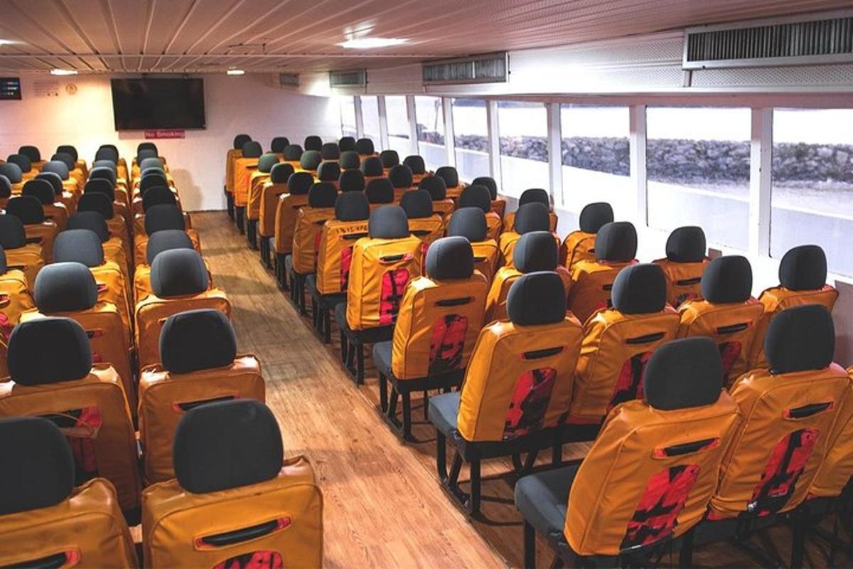 a room with rows of chairs in a building